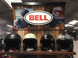 A row of Bell motorcycle helmets